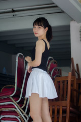 Portrait of thai adult beautiful girl black shirt white skirt relax time