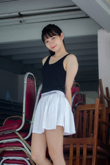 Portrait of thai adult beautiful girl black shirt white skirt relax time