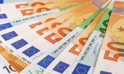 closeup 50 and 100 euros banknotes background