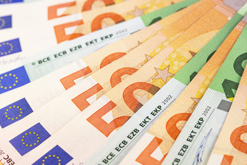 closeup fifty and hundred euros banknotes background