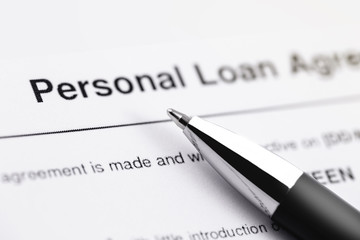 closeup personal loan application form with black pen