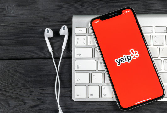 Sankt-Petersburg, Russia, June 2, 2018: Yelp application icon on Apple iPhone X screen close-up. Yelp app icon. Yelp.com application. Social network. Social media