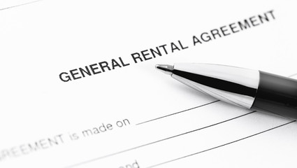 general rental agreement form application with black pen closeup
