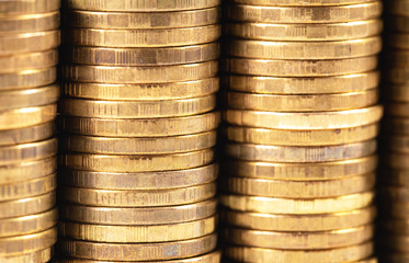 stack of metal golden coins closeup macro