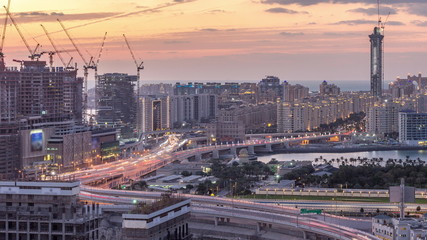 Fototapeta na wymiar Palm Jumeirah Highway bridge aerial day to night timelapse. Dubai, United Arab Emirates