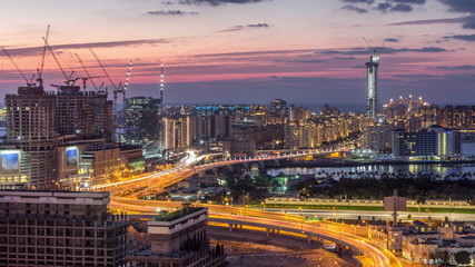 Palm Jumeirah Highway bridge aerial day to night timelapse. Dubai, United Arab Emirates