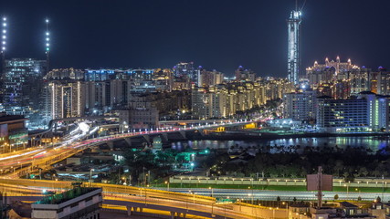 Fototapeta na wymiar Palm Jumeirah Highway bridge aerial night timelapse. Dubai, United Arab Emirates