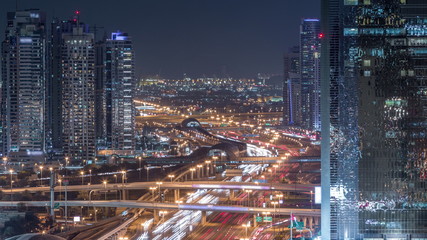 Fototapeta na wymiar Dubai Marina and JLT aerial night timelapse top view of skyscrapers in Dubai, UAE.