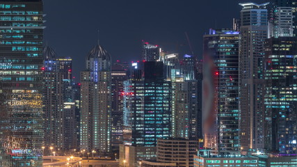 Dubai Marina and JLT aerial night timelapse top view of skyscrapers in Dubai, UAE.
