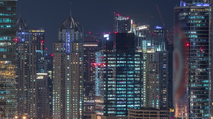 Fototapeta na wymiar Dubai Marina and JLT aerial night timelapse top view of skyscrapers in Dubai, UAE.