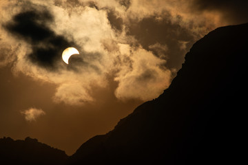 Solar eclipse and mountain