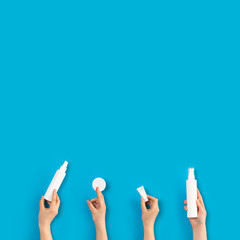 Homemade skin care and body with natural ingredients on blue background with flat lay.