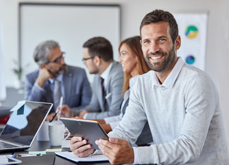 businessman office portrait corporate meeting tablet