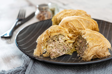 Blanched cabbage leaves surrounding a pork and turkey preparation and soy protein.