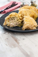 Blanched cabbage leaves surrounding a pork and turkey preparation and soy protein.