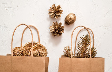 Christmas handmade gift boxes decorated with craft paper and white snowflakes on white wooden background top view. Merry christmas greeting card. Winter xmas holiday theme. Happy New Year. Flat lay.