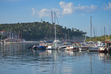 Fototapeta na wymiar Docked ships in marina in Makarska, Croatia on June 17, 2019.