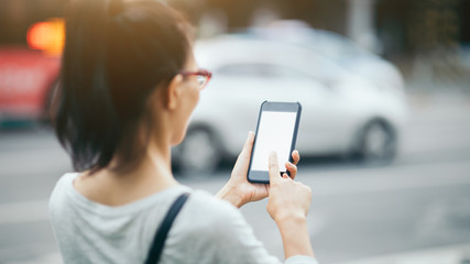 Woman use smartphone at city