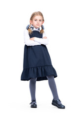 Little confident girl schoolgirl in uniform isolated on white background