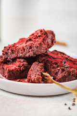 Beet brownie on gray plate. Healthy vegan food concept.