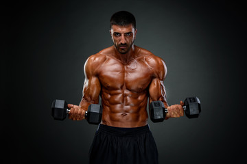 Obraz na płótnie Canvas Strong Muscular Men Lifting Weights
