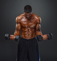 Fototapeta na wymiar Strong Muscular Men Lifting Weights