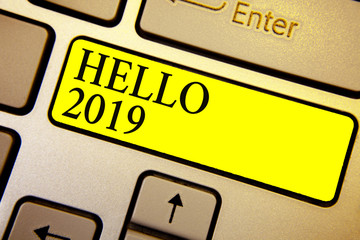 Handwriting text Hello 2019. Concept meaning Hoping for a greatness to happen for the coming new year Keyboard yellow key Intention create computer computing reflection document