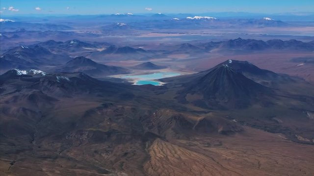 Aerial view of the mountains in Bolivian Altiplano region. Volcano of Licancabur (mountain at the right) and two lakes (Laguna Verde and Laguna Blanca) are visible in the frame