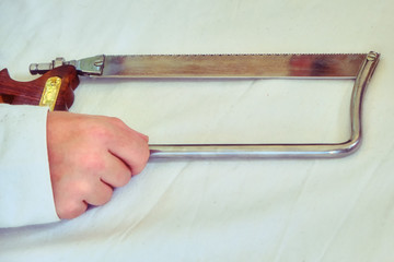 Retro saw for operations in the old days. Medical instrument for surgical amputations.