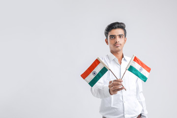 Young indian man with indian flag