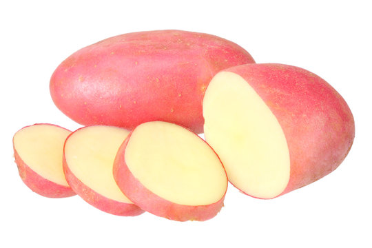 Raw red potato with slices isolated on white background