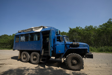 Obraz premium Mutnovsky, Kamchatka / Russia - July 26 2019: Ural truck - six wheel off road all terrain vehicle of Russian origin, meant for transporting military as well as civilians in harsh road conditions.