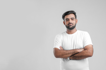 young Indian man giving multiple expression.