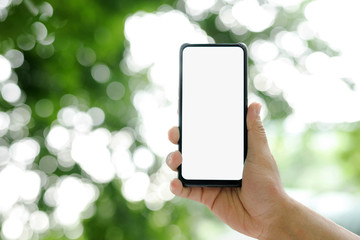 Hand-held images, smart phones, white background screens and bokeh backgrounds.