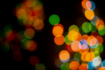 Bokeh abstract texture. Colorful. Defocused background.Bright lights on dark background.