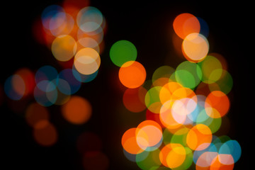 Bokeh abstract texture. Colorful. Defocused background.Bright lights on dark background.