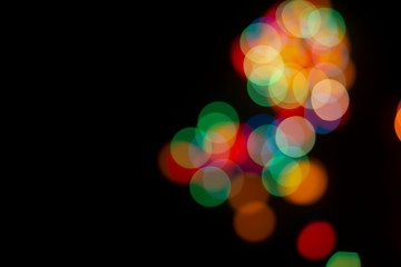 Bokeh abstract texture. Colorful. Defocused background.Bright lights on dark background.