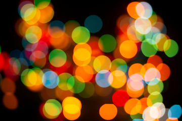 Bokeh abstract texture. Colorful. Defocused background.Bright lights on dark background.