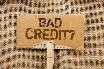Writing note showing Bad Credit Question. Business photo showcasing Low Credit Finance Economic Budget Asking Questionaire written Cardboard Piece Holding By Clip the jute background.