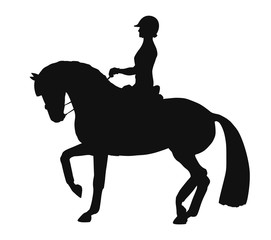 Silhouette of a rider and horse execute the piaffe
