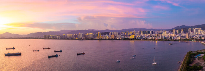 Sanya town evening cityscape, view from Phoenix island on Hainan Island of China © dtatiana
