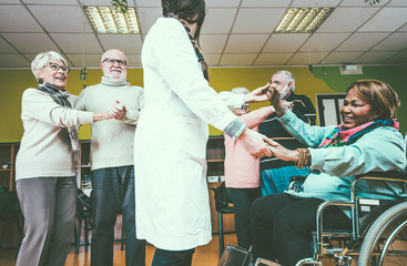 Group of seniors making activities inside the hospice.