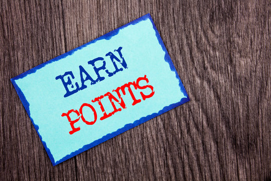 Writing text showing Earn Points. Business photo showcasing Loyalty Reward Benefit Program For Earning Customer Point written Blue Sticky Note Paper the wooden background.