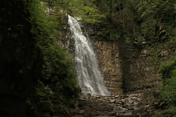 Fototapeta na wymiar Waterfall. Waterfall in the Carpathian Mountains, Manyava village Ukraine