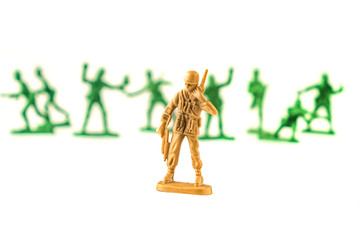 lot of plastic toy soldiers on white background.