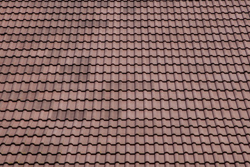 Brown roof with metal tile on blue sky