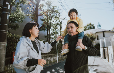 Happy japanese family spending time outdoor