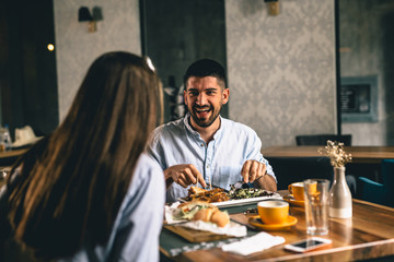 couple on romantic dinner in fancy restaurant
