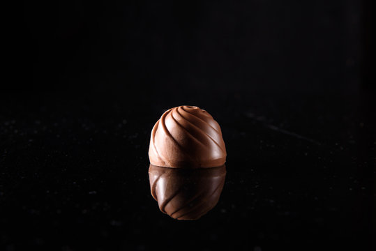 chocolate candy on a black background