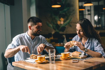 romantic couple having breakfast at snack bar